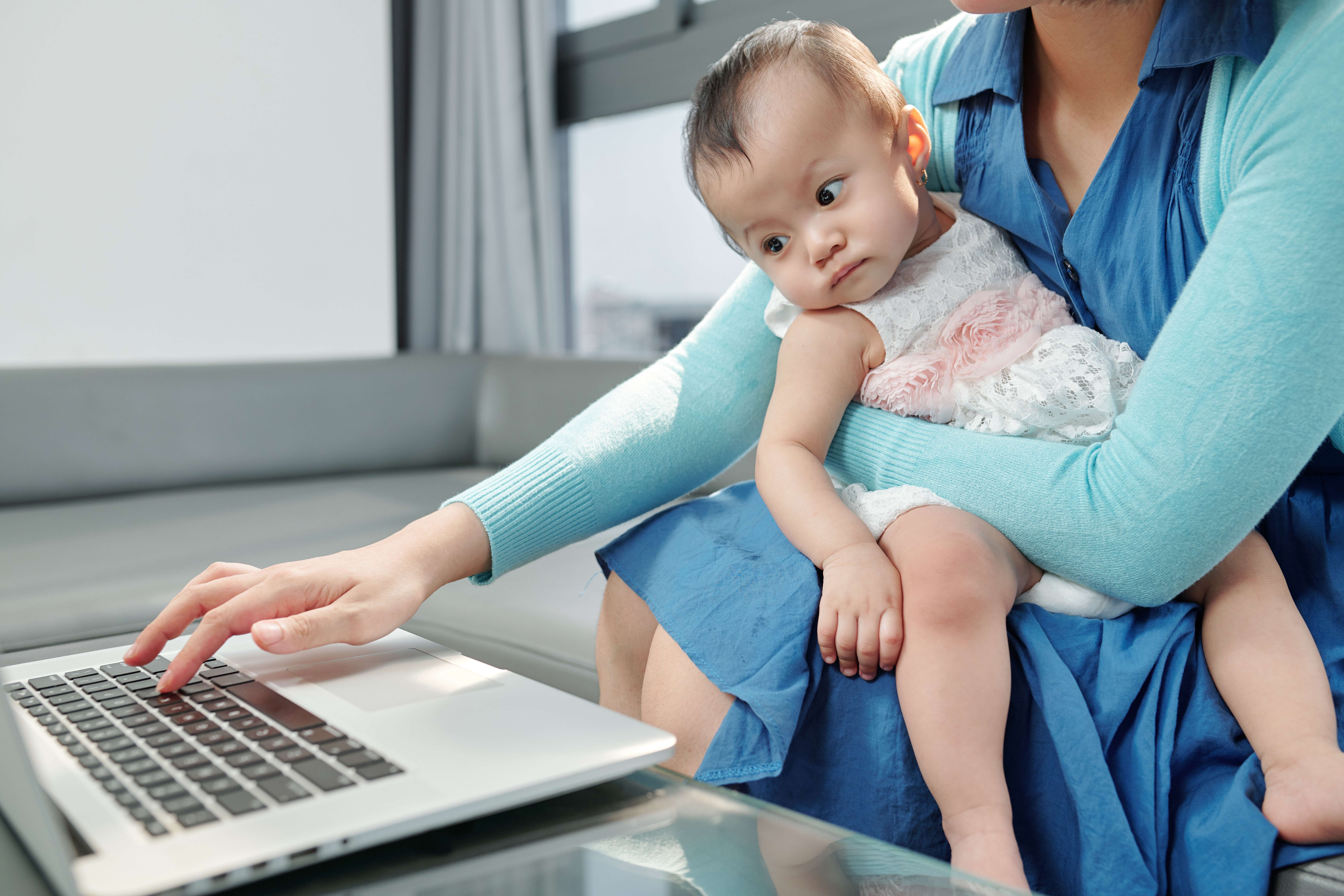 a mother with her baby choosing the best confinement nanny in Singapore