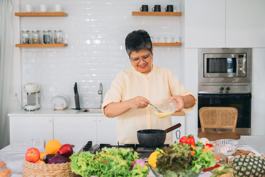 a confinement nanny cooking recovery meals for a new mother in singapore