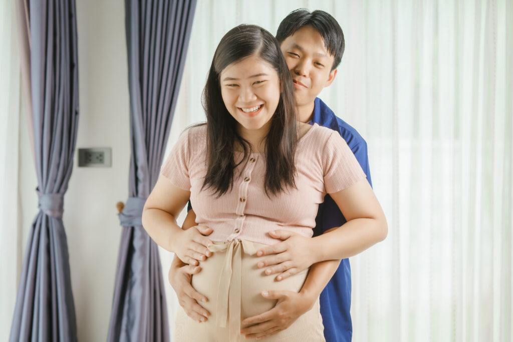 Expectant couple preparing for their baby's arrival during pregnancy.